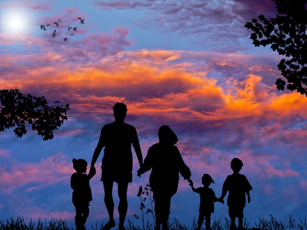 silhouette of family & colorful sky with clouds used for life insurance image
